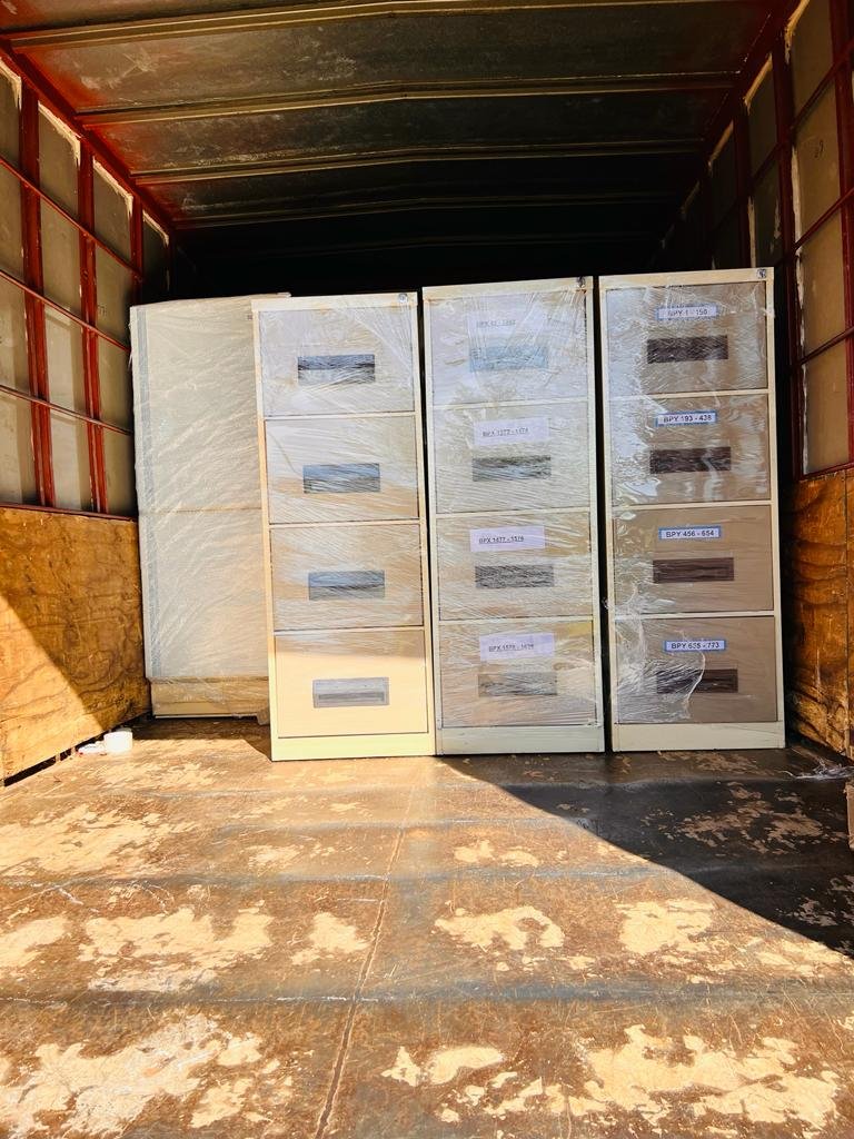 Wrapped filing cabinets secured inside a moving truck